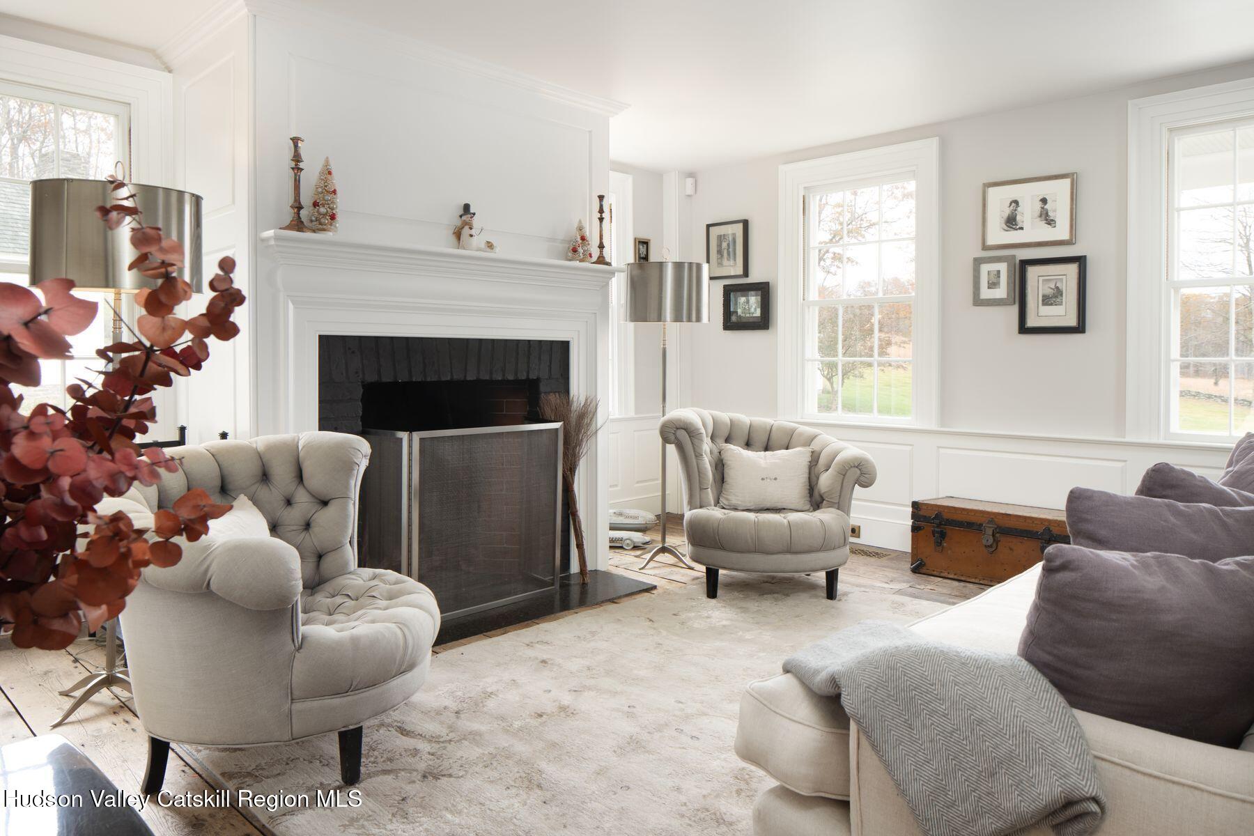 2073 Highway 82 Ancram, NY 12502 - Photo 8 of 22 a living room with furniture and a fireplace