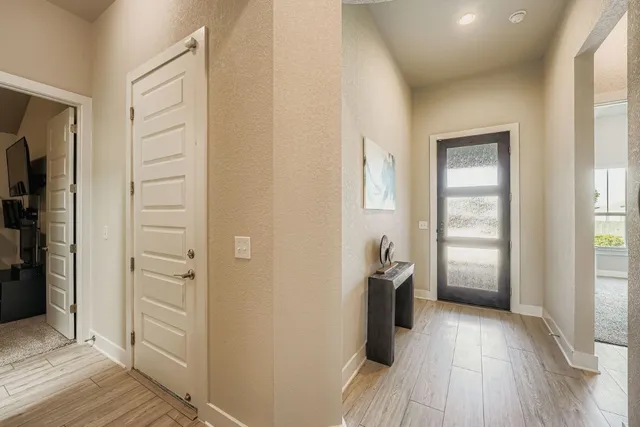 wooden floor in an empty room and a window
