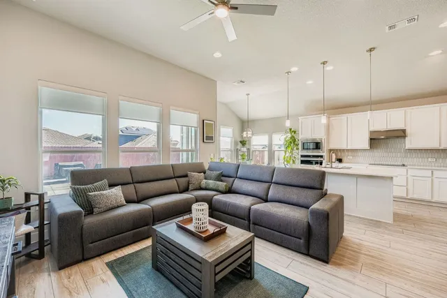 a living room with furniture and a large window
