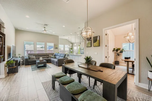 a view of a living room and dining room