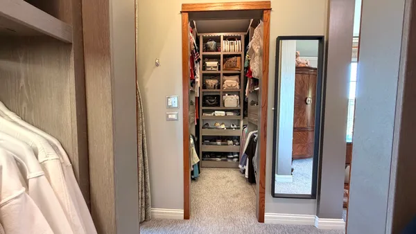 a kitchen with stainless steel appliances granite countertop a refrigerator a stove and a sink