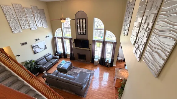 a view of a dining room with furniture and a window