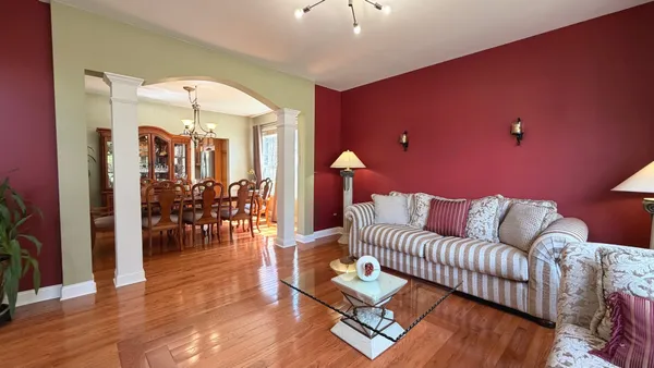 a living room with furniture fireplace and flat screen tv
