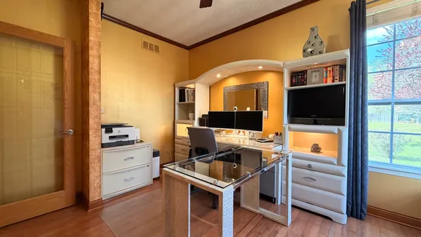 a spacious bathroom with a tub shower and toilet