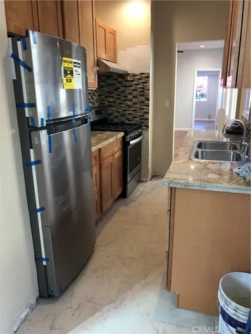 a kitchen with refrigerator and countertop
