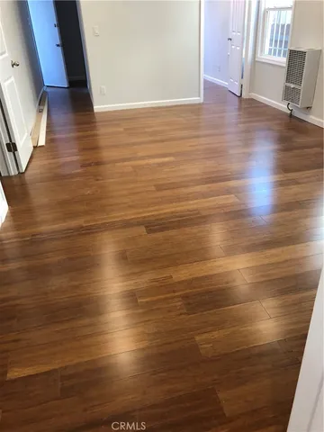 a view of room with wooden floor