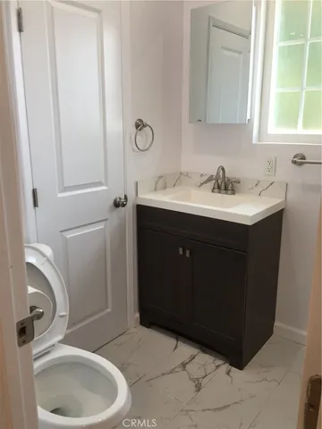 a bathroom with a sink and a vanity