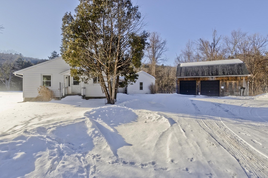 16 Knightville Dam Road Huntington, MA 01050 - Photo 1 of 40 a view of a house with snow on the road