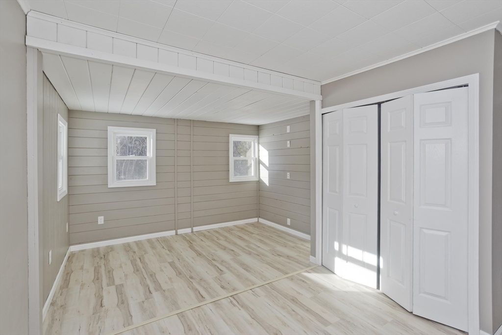 16 Knightville Dam Road Huntington, MA 01050 - Photo 13 of 40 a view of an empty room with wooden floor and a window