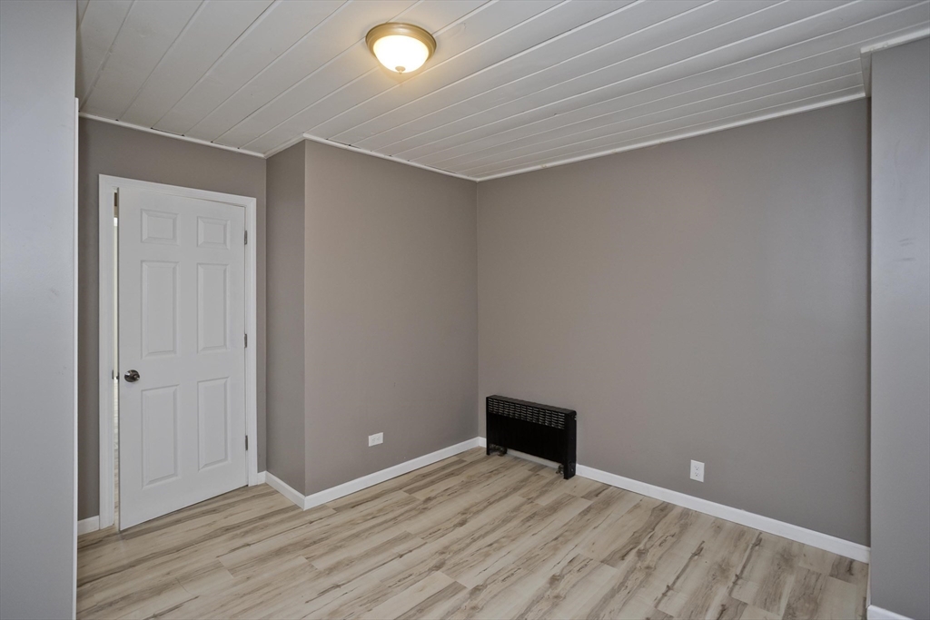 16 Knightville Dam Road Huntington, MA 01050 - Photo 16 of 40 a view of an empty room with wooden floor