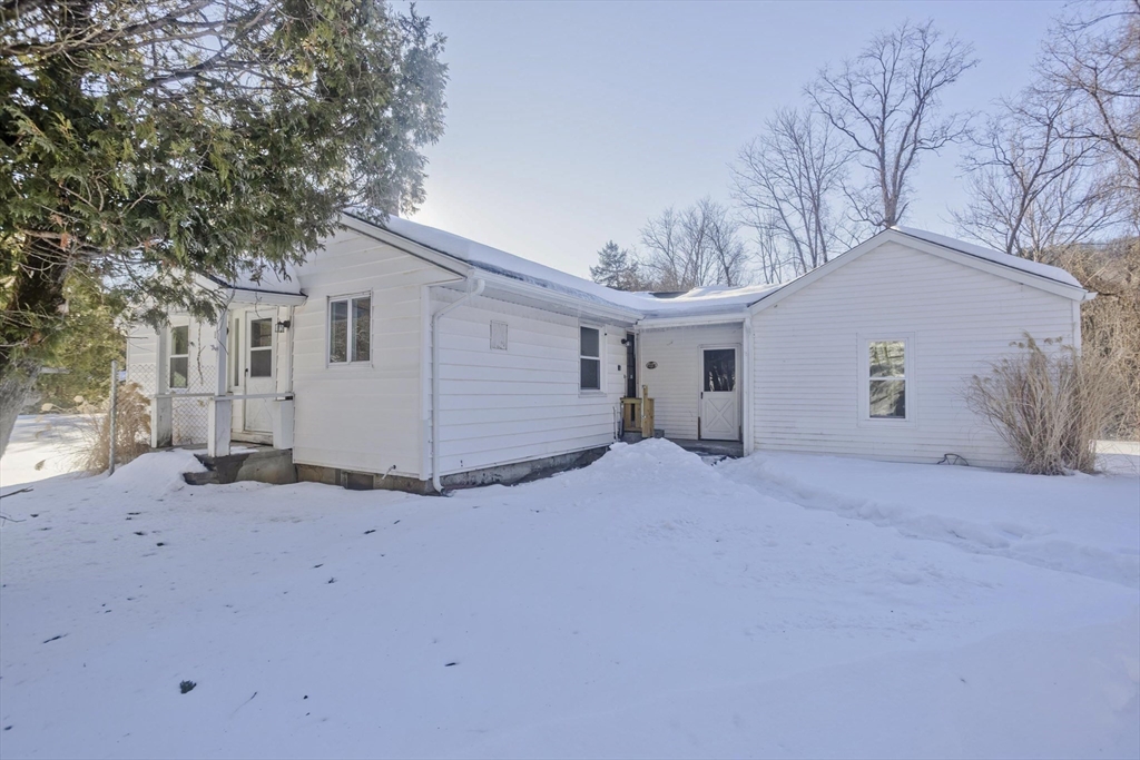 16 Knightville Dam Road Huntington, MA 01050 - Photo 2 of 40 a view of a house with a snow in the yard