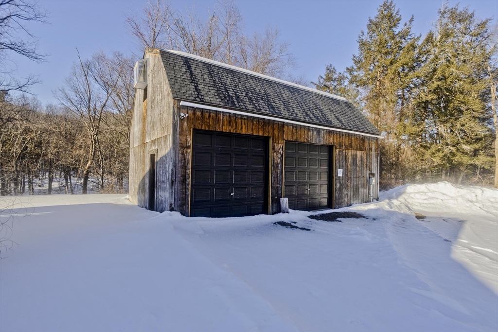 16 Knightville Dam Road Huntington, MA 01050 - Photo 29 of 40 a view of an house with a yard and garage