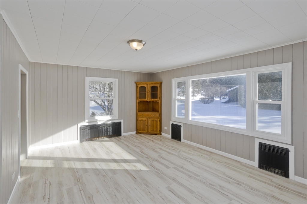 16 Knightville Dam Road Huntington, MA 01050 - Photo 5 of 40 a spacious bedroom with a large bed and a window