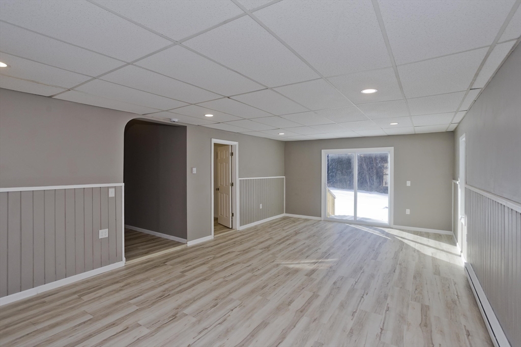 16 Knightville Dam Road Huntington, MA 01050 - Photo 9 of 40 a view of an empty room with wooden floor and a window
