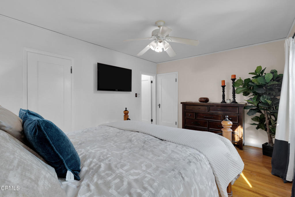 1807 Vistillas Road Altadena, CA 91001 - Photo 17 of 38 a bedroom with a bed and a flat screen tv