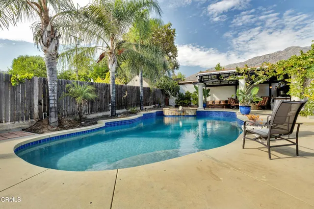 a view of a swimming pool with a seating space