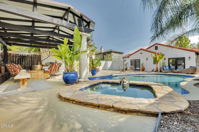 a view of a swimming pool with a patio