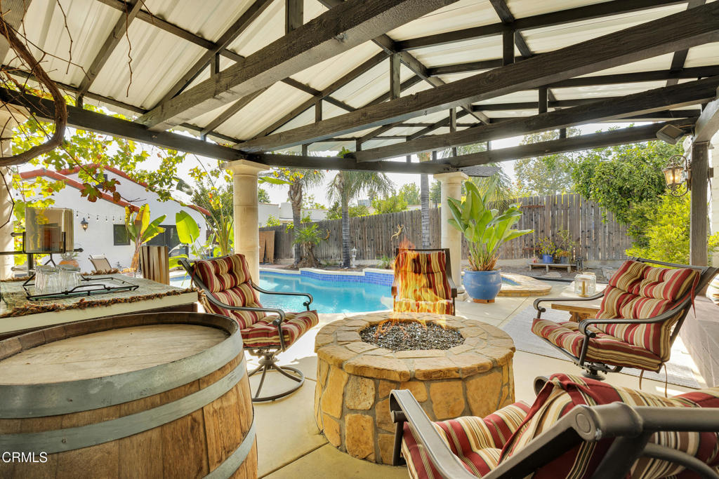 1807 Vistillas Road Altadena, CA 91001 - Photo 31 of 38 a view of a patio with a table chairs and a barbeque