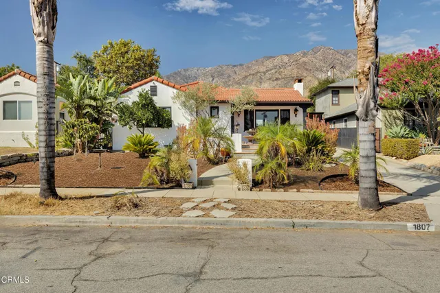 a view of house with yard