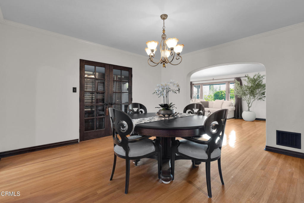 1807 Vistillas Road Altadena, CA 91001 - Photo 10 of 38 a view of a dining room with furniture wooden floor and chandelier