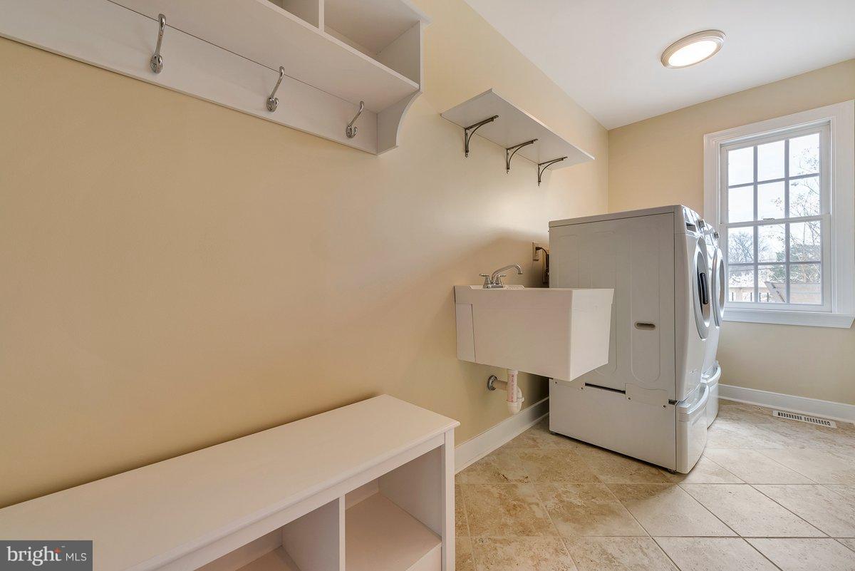 17001 Spates Hill Road Poolesville, MD 20837 - Photo 17 of 30 Main floor laundry has sink and room for folding