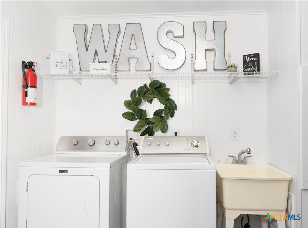 564 Cypress Valley Road Cuero, TX 77954 - Photo 21 of 40 a utility room with dryer and washer