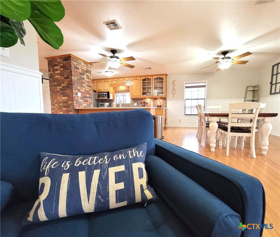 564 Cypress Valley Road Cuero, TX 77954 - Photo 8 of 40 a view of a living room and chandelier fan