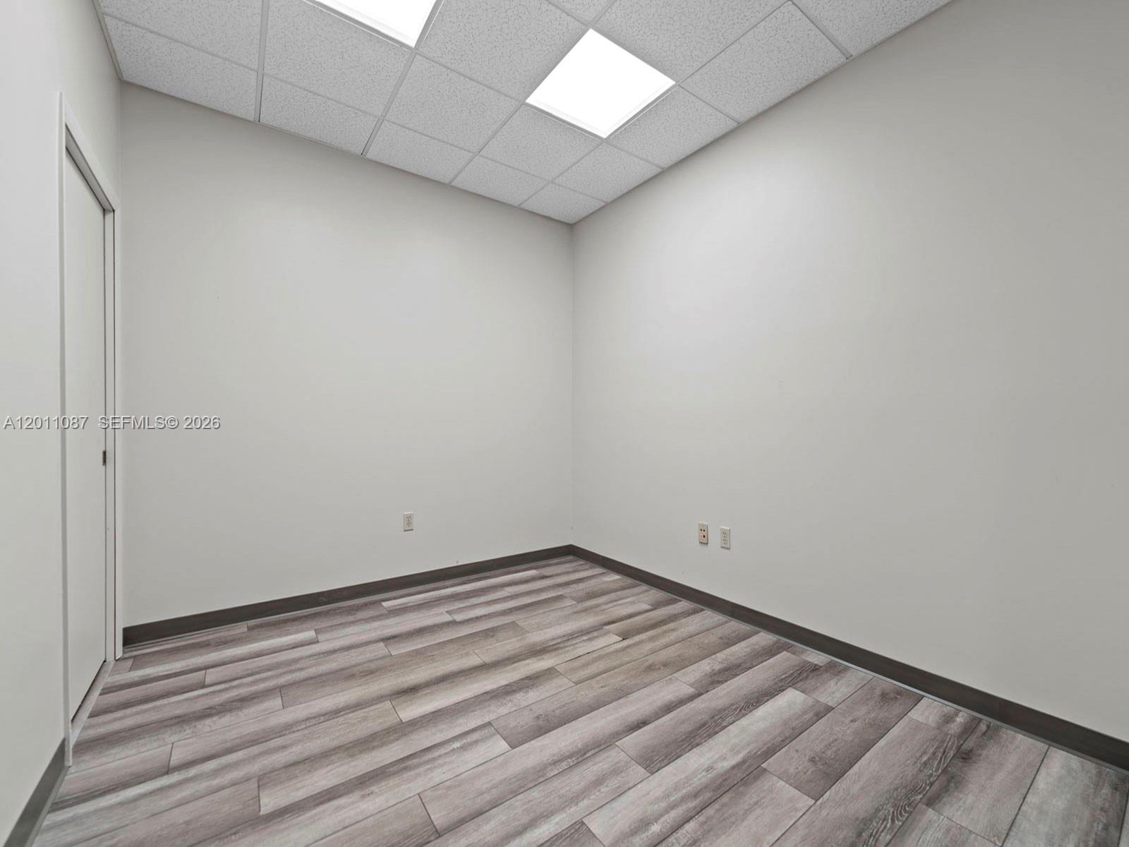 735 Shotgun Road Sunrise, FL 33326 - Photo 13 of 21 a view of room with wooden floor