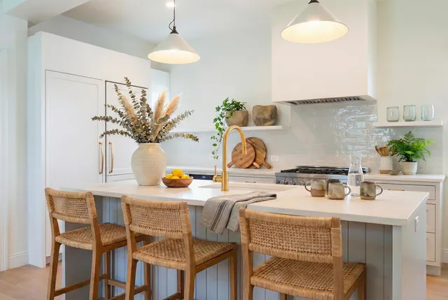 a kitchen with a table and chairs in it