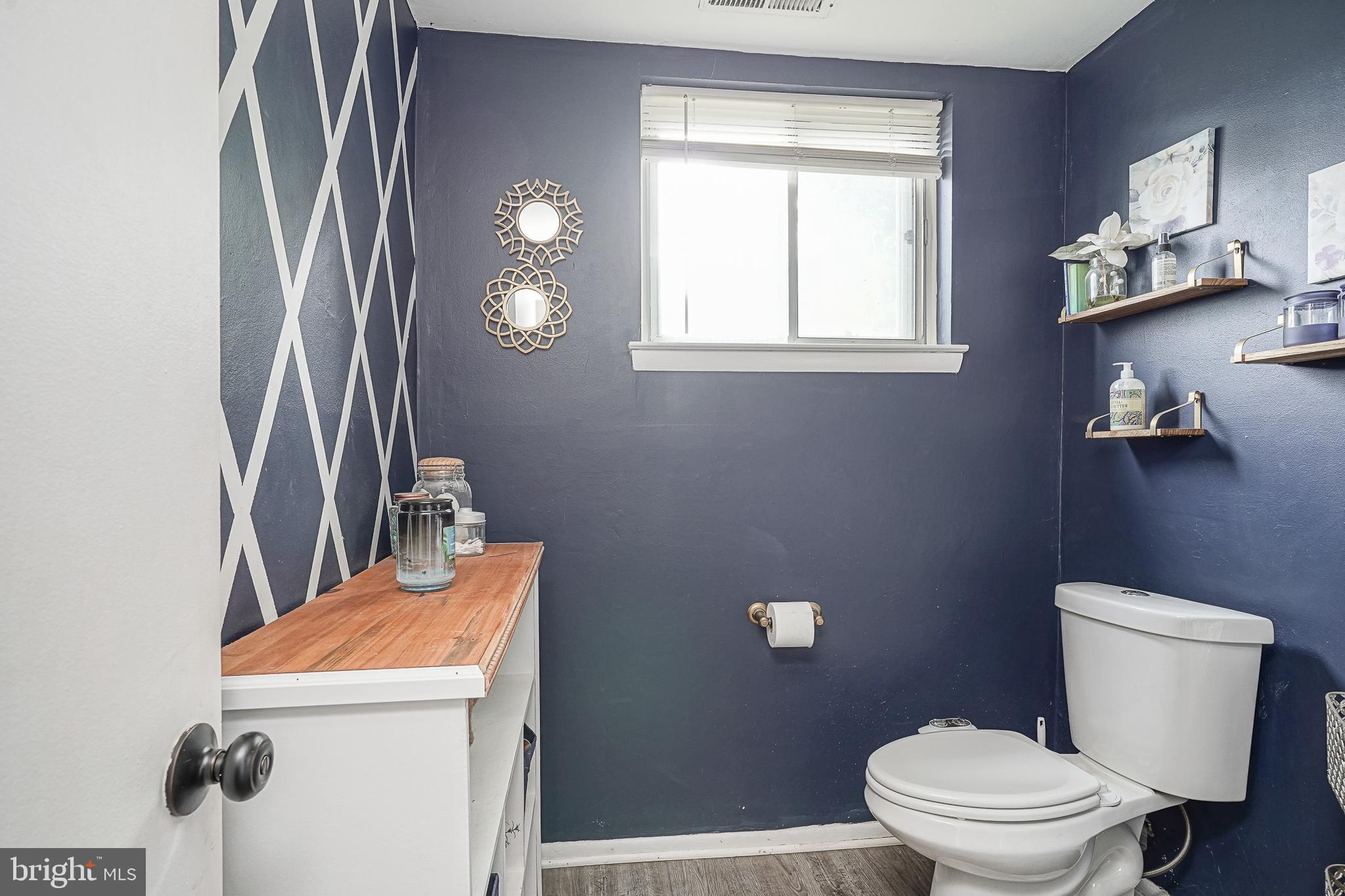47 Bryant Road Blackwood, NJ 08012 - Photo 16 of 21 a bathroom with a sink a toilet and mirror