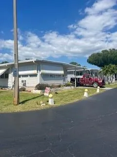 a view of an swimming pool with a yard
