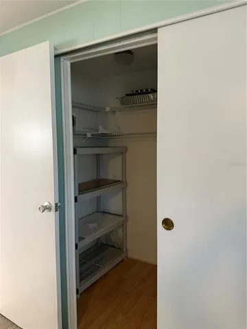 a view of storage and utility room with washer and dryer