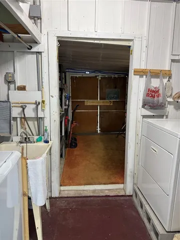 a room with a fireplace and cabinets