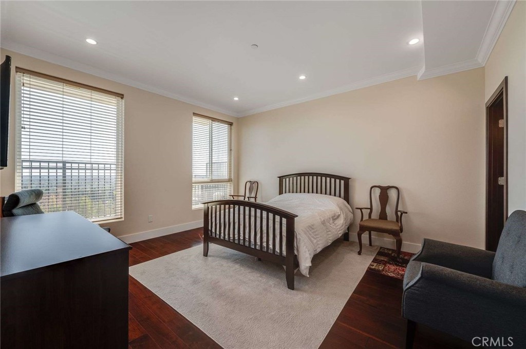 11837 Rideout Way Whittier, CA 90601 - Photo 17 of 44 a bedroom with a bed and wooden floor
