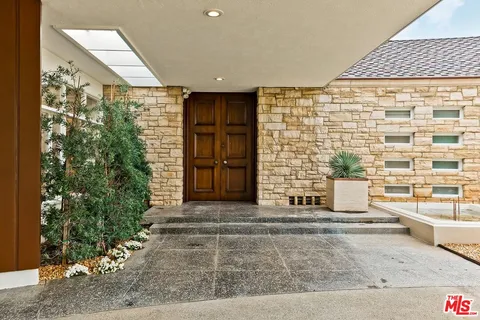 a view of entrance with an outdoor space