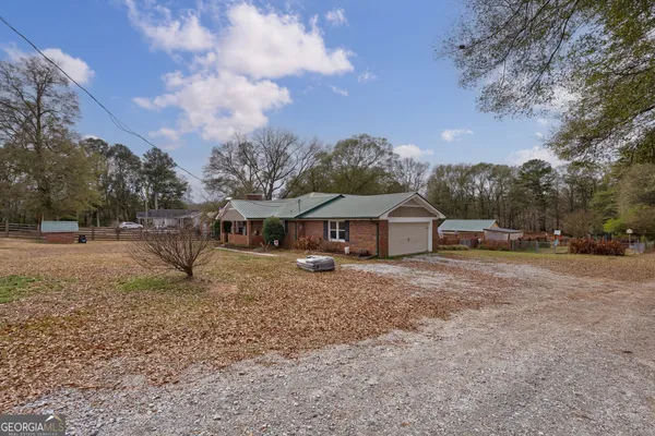 a kitchen with stainless steel appliances granite countertop a refrigerator a stove a sink and a refrigerator
