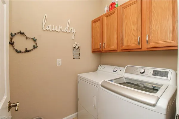 a utility room with dryer and washer