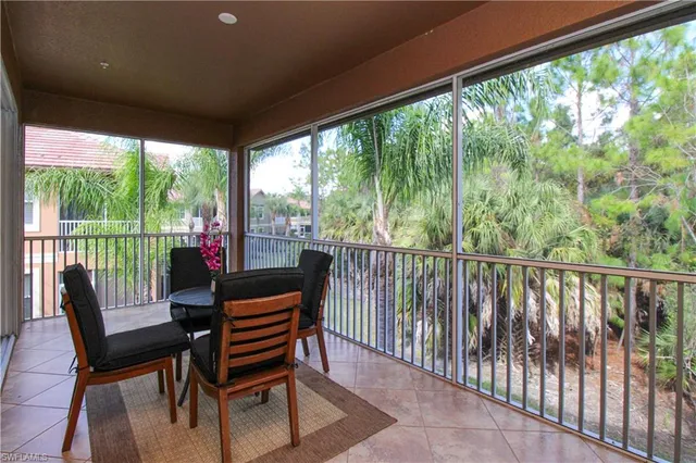 a balcony with wooden floor outdoor seating and city view