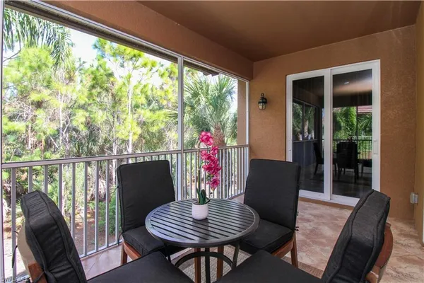 a balcony view with a seating space
