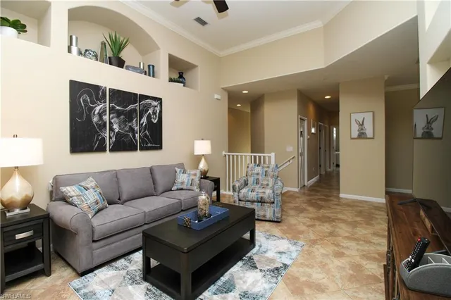 a living room with furniture and a rug
