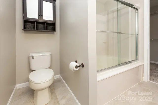 a bathroom with a toilet and a sink