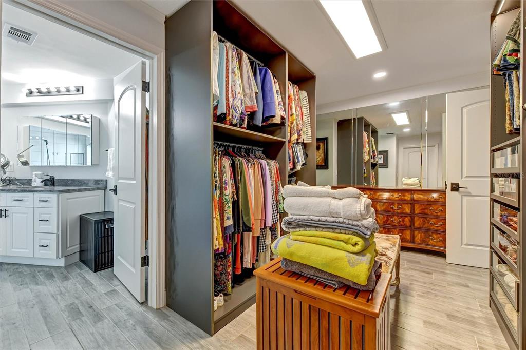1875 Belleair Road Clearwater, FL 33764 - Photo 33 of 100 a view of walk in closet with clothes and shoes