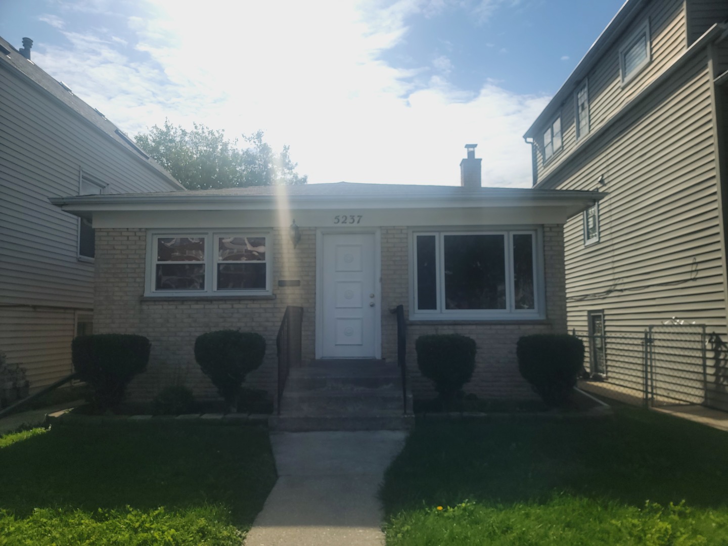5237 West Roscoe Street Chicago, IL 60641 - Photo 1 of 27 a front view of a house with yard