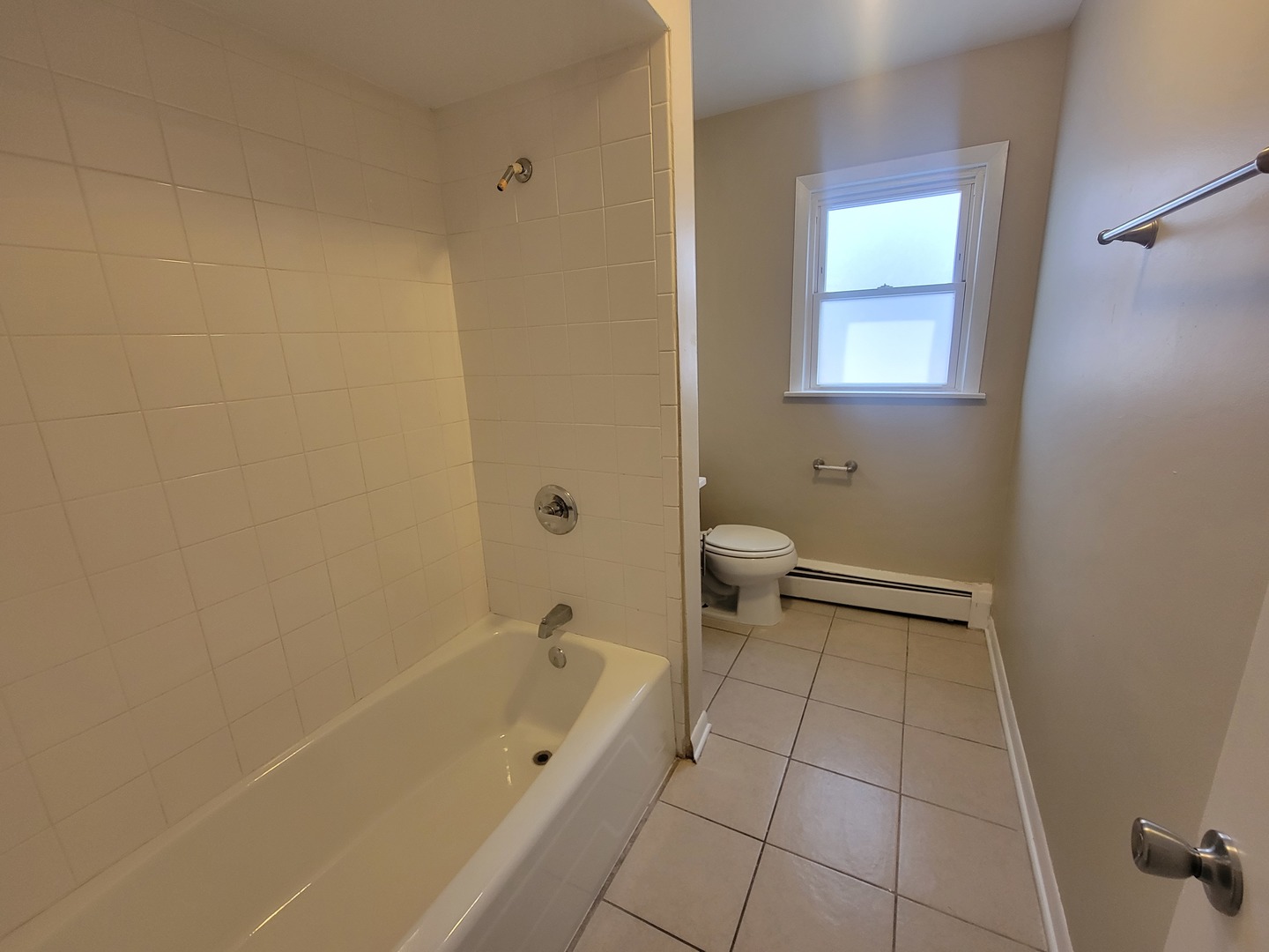 5237 West Roscoe Street Chicago, IL 60641 - Photo 11 of 27 a bathroom with a bathtub and a shower