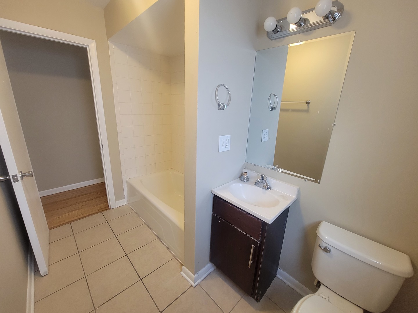 5237 West Roscoe Street Chicago, IL 60641 - Photo 12 of 27 a bathroom with a sink toilet and shower