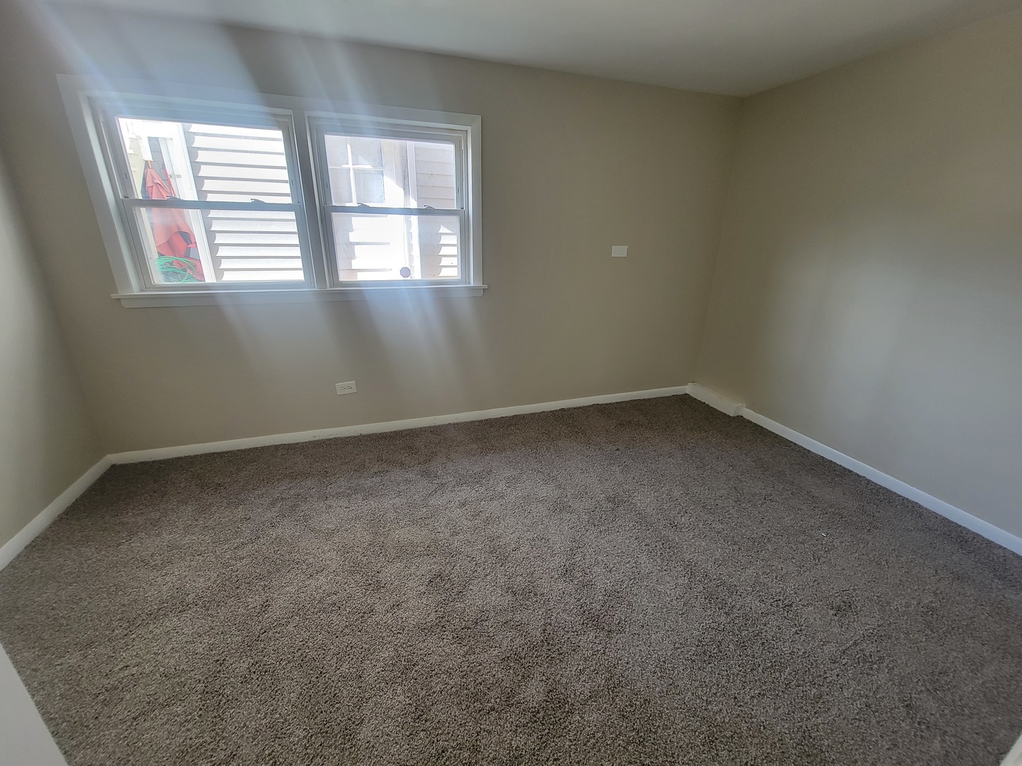 5237 West Roscoe Street Chicago, IL 60641 - Photo 14 of 27 an empty room with windows