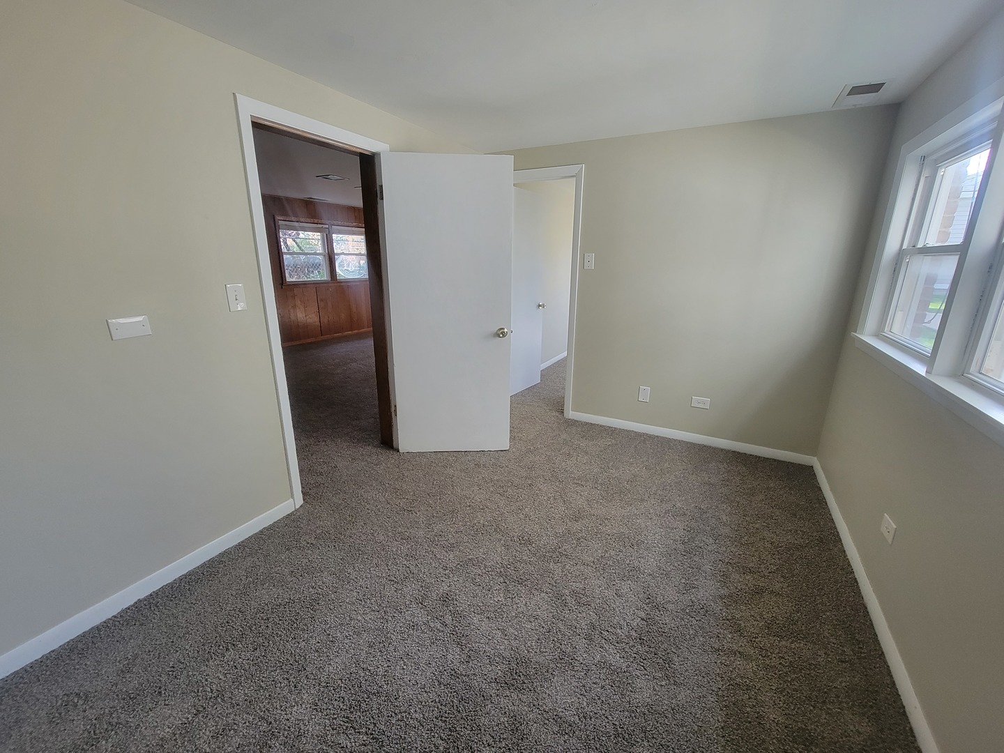 5237 West Roscoe Street Chicago, IL 60641 - Photo 15 of 27 an empty room with windows