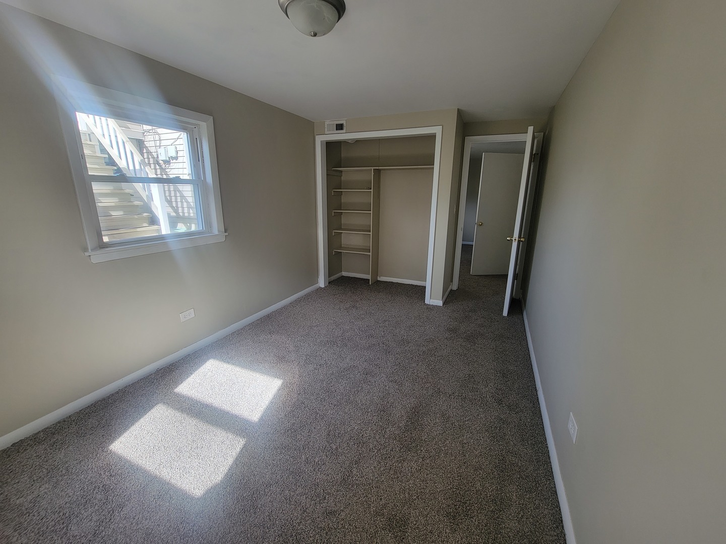 5237 West Roscoe Street Chicago, IL 60641 - Photo 16 of 27 an empty room with windows