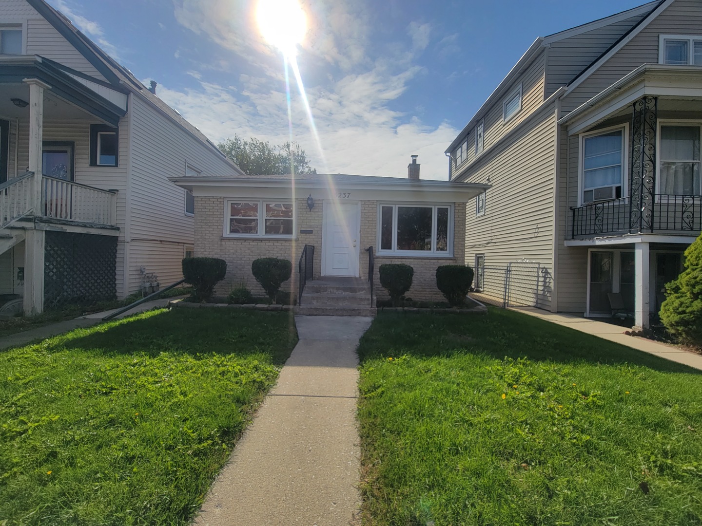 5237 West Roscoe Street Chicago, IL 60641 - Photo 2 of 27 a house view with a garden space