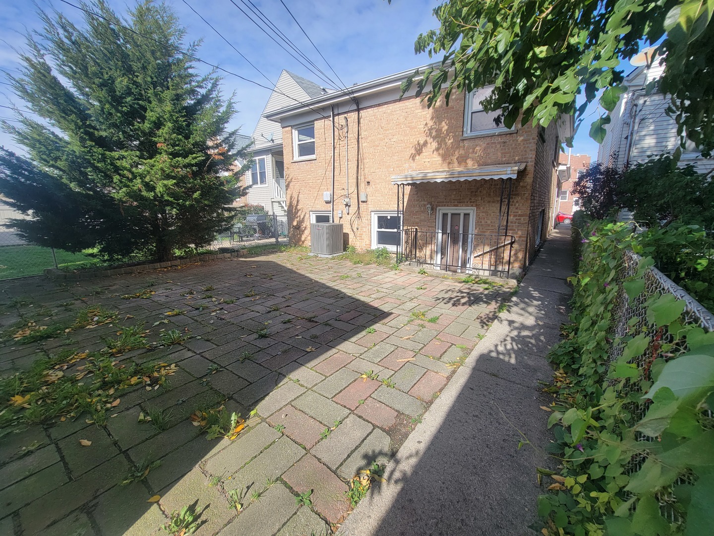 5237 West Roscoe Street Chicago, IL 60641 - Photo 27 of 27 a front view of a house with a yard